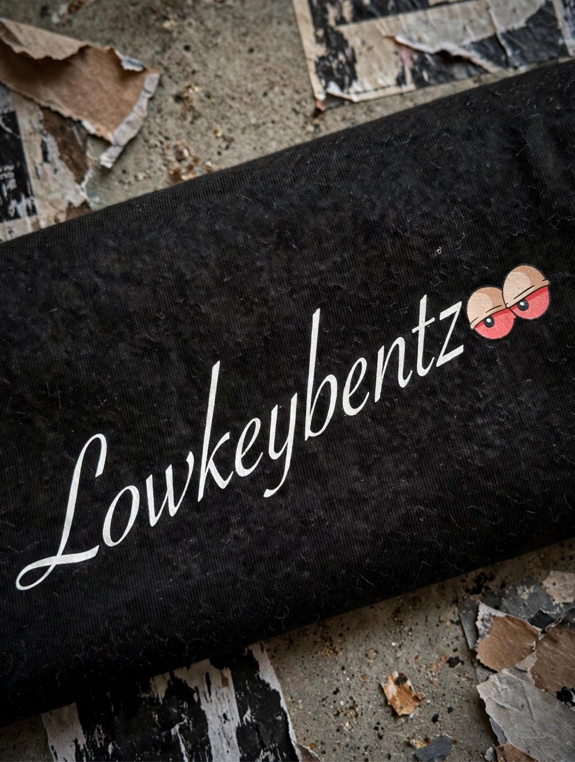 LOWKEYES T ALBINO script close-up on fabric