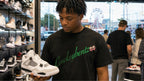 LOWKEYES FOREST GREEN worn by model at sneaker store
