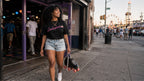 PINK PANTHER worn by model on street with skates