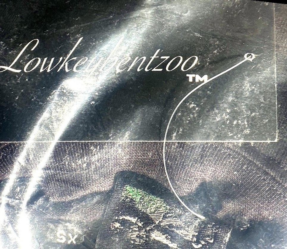 Lowkeybentzoo woven neck label and hang tag close-up